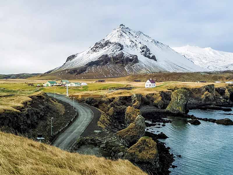 Snæfellsnes Peninsula Fishing Village and mountains with snow at western Iceland