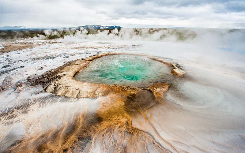Pool with boiling geothermal water in the heart of Iceland