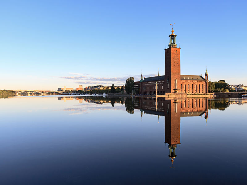 Stockholm City Hall with reflection on water at morning, Sweden.