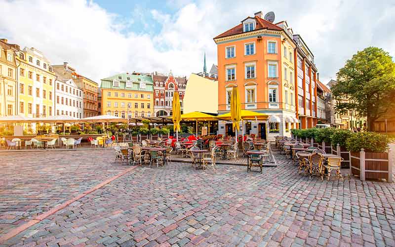 Dome square with cafes and restaurants in the old town center in Riga, Latvia