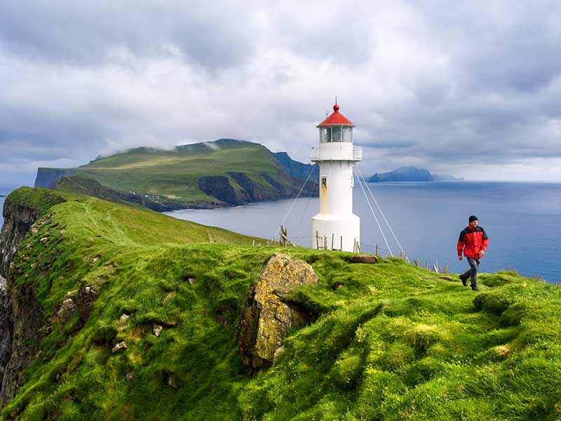 Mykinesholm islet lighthouse near Mykines island. Mykinesholmur, Faroe islands.